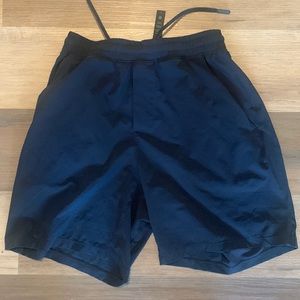 Small navy Lululemon Pace Breaker 7’ inseam shorts (liner less)